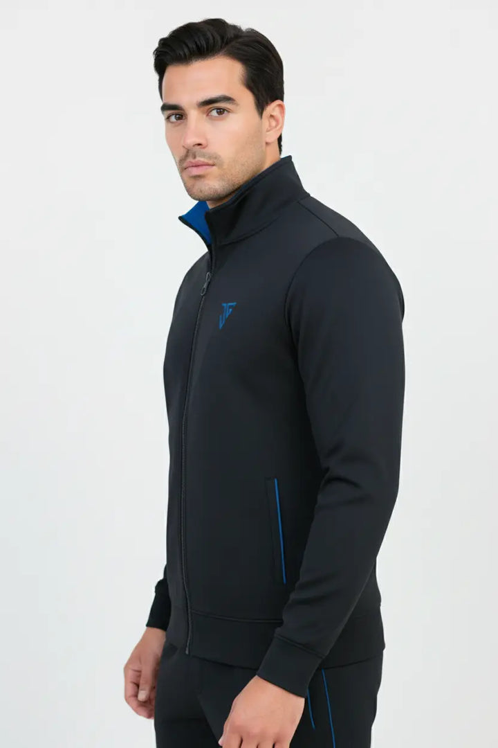 Man wearing black and blue Pride Jacket by JYGMA in a front side pose