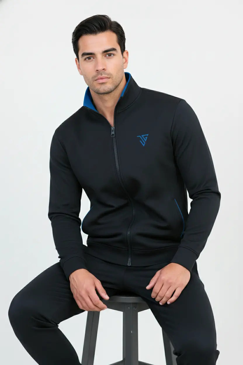 Model seated wearing black and blue Pride Jacket for everyday comfort