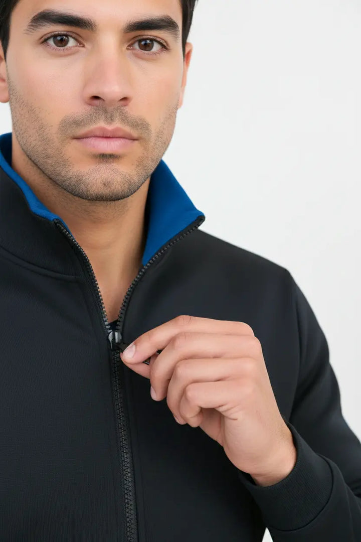 Close-up of zipper and collar detail on black and blue Pride Jacket