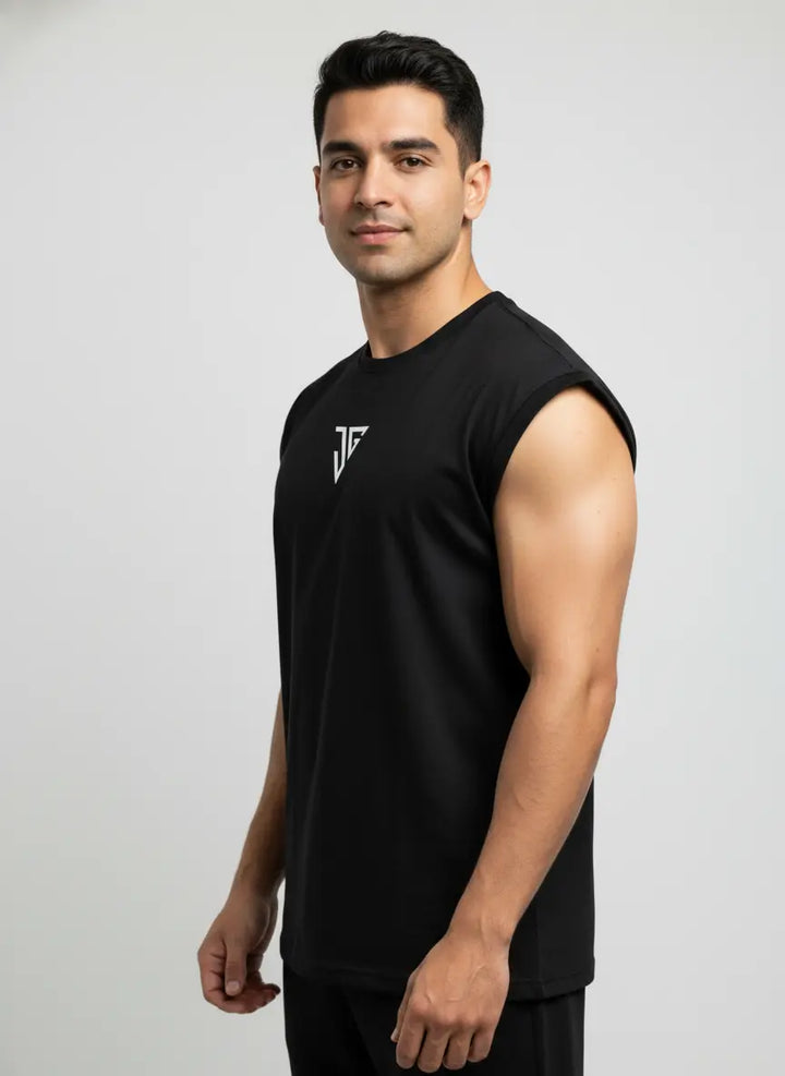 Side view of black oversized tank top showing relaxed fit