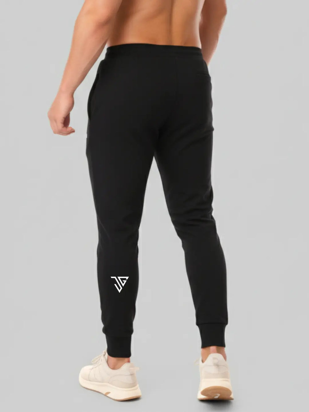 Back view of black performance joggers worn by model