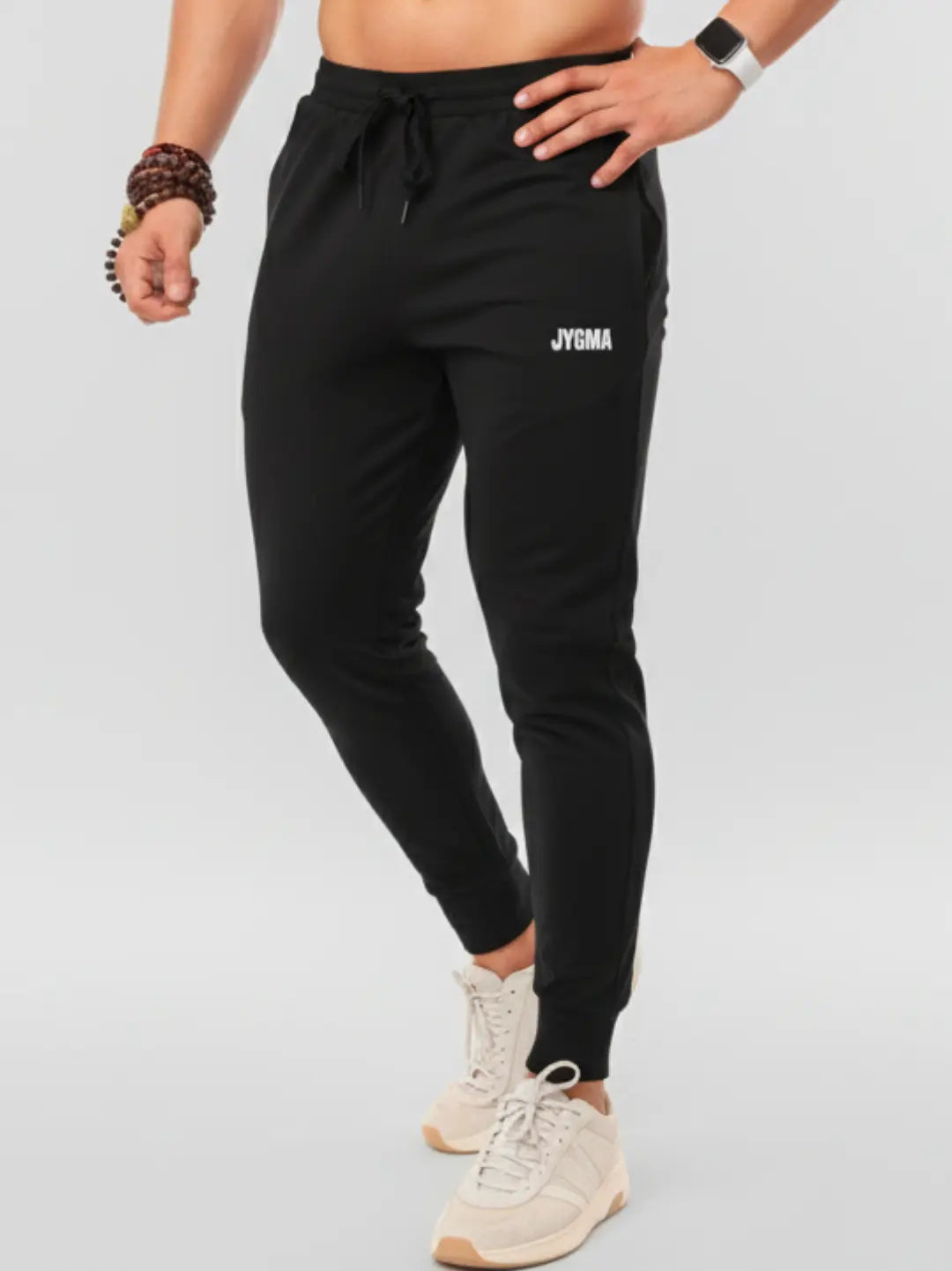 Men wearing black performance joggers by JYGMA