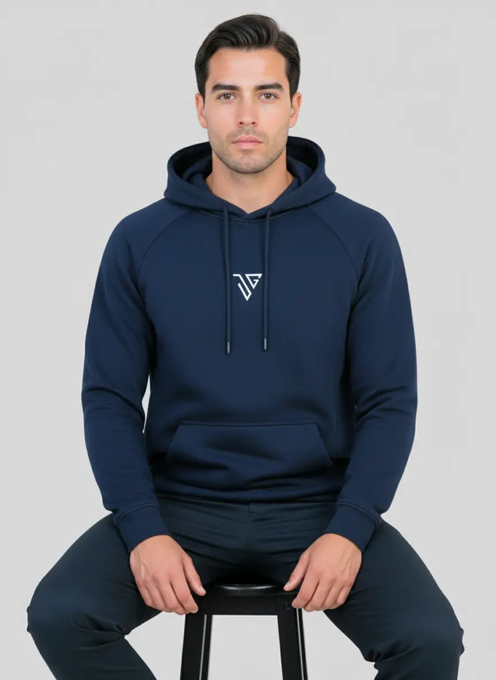 Model seated wearing navy blue Pride Hoodie for comfort